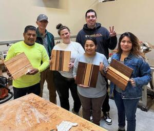 Proud Woodshop Adventure group with finished cutting boards